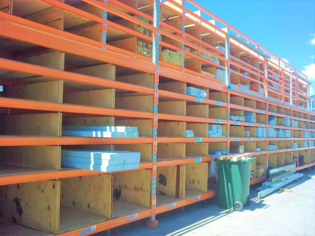 Long span shelving with timber decks in an outdoor yard